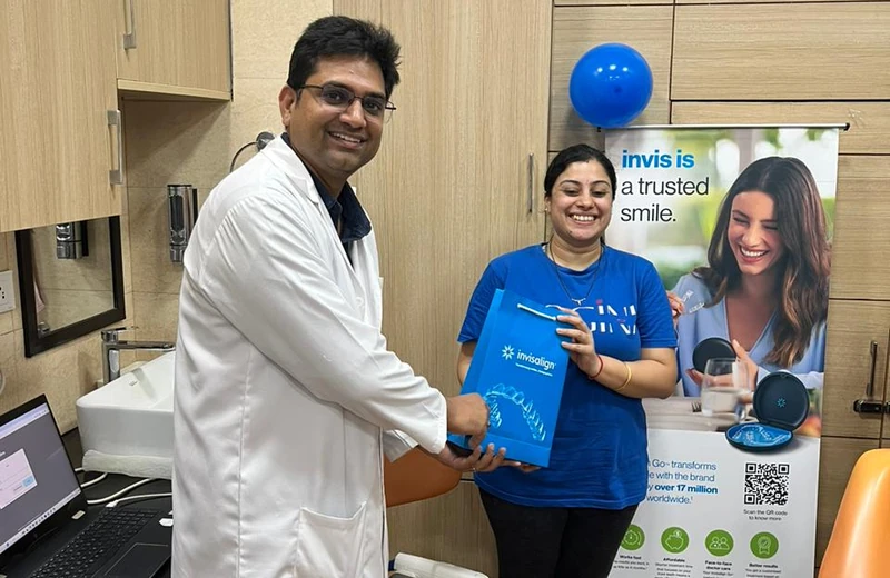 Happy patient receiving Invisalign treatment at Root Care Dental Clinic, Gurugram